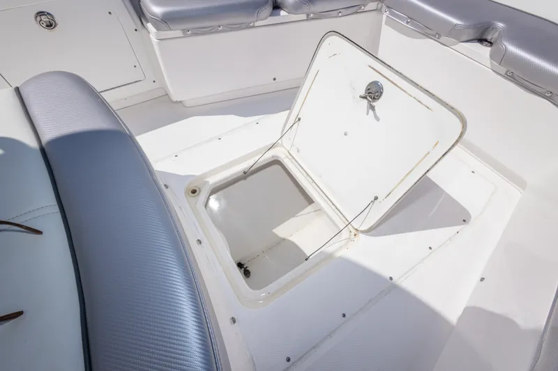 Slide: The Image of Open storage compartment on 2012 Everglades 243 Center Console boat. - 33