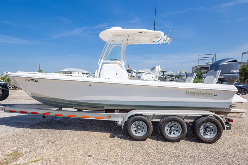 Slide: The Image of 2012 Everglades 243 Center Console boat on trailer, clear sky background. - 14