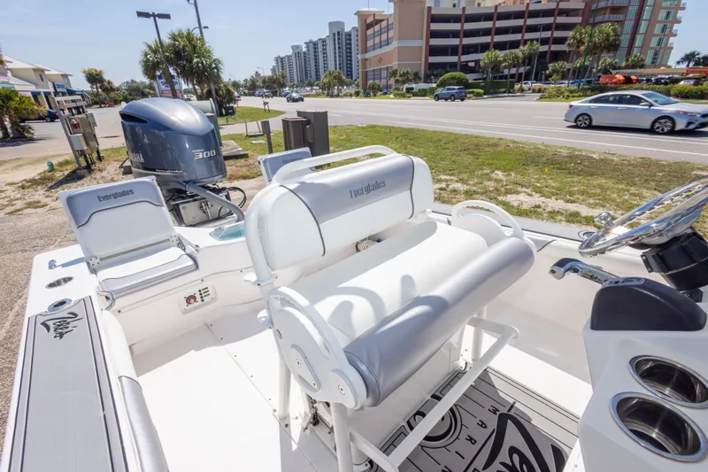 Slide: The Image of 2012 Everglades 243 Center Console boat with Yamaha 300 engine, parked near a road. - 38