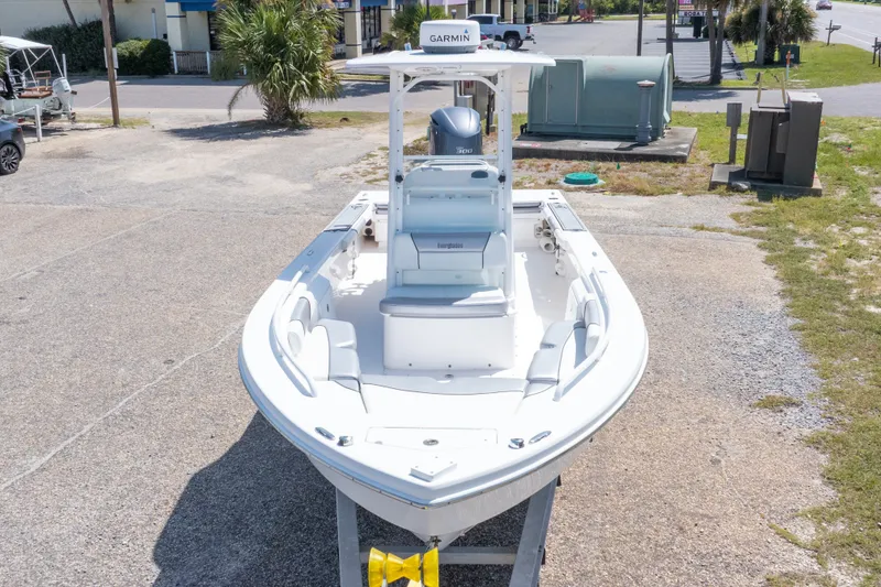 Slide: The Image of 2012 Everglades 243 Center Console boat with Garmin equipment, parked on a concrete surface. - 5