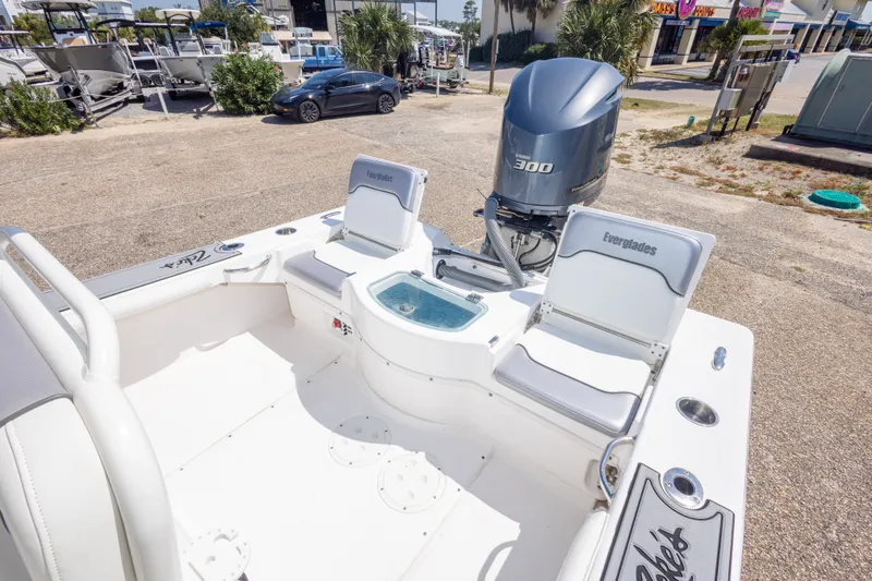 Slide: The Image of 2012 Everglades 243 Center Console boat with Yamaha 300 engine, docked outdoors. - 40