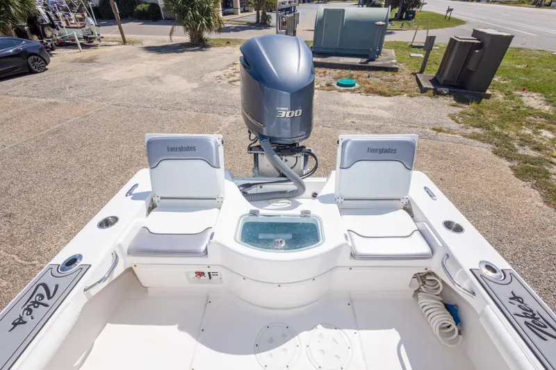 Slide: The Image of 2012 Everglades 243 Center Console boat with Yamaha 300 engine, featuring seating and storage. - 42