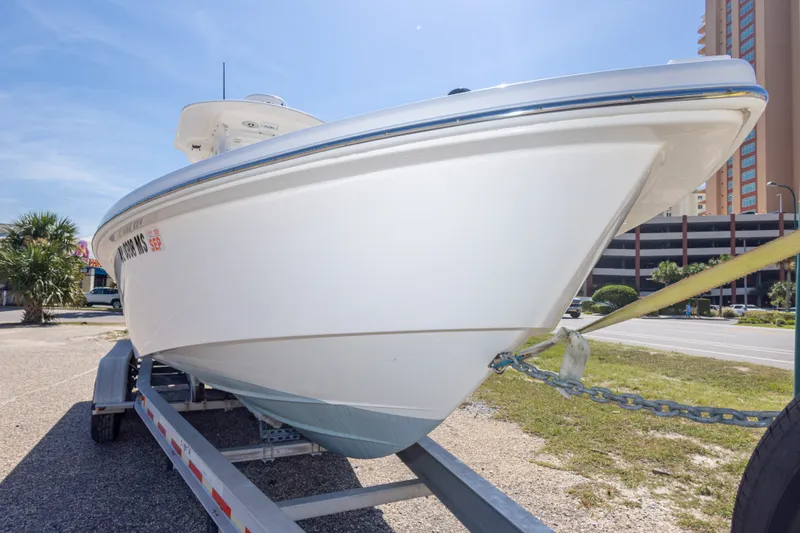 Slide: The Image of 2012 Everglades 243 Center Console boat on trailer, sunny day, urban background. - 17