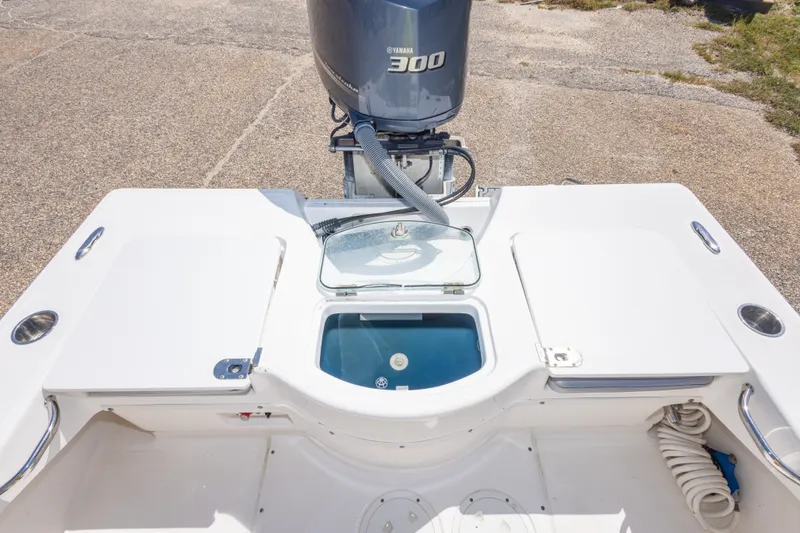 Slide: The Image of 2012 Everglades 243 Center Console boat with Yamaha 300 engine, featuring a spacious deck layout. - 43