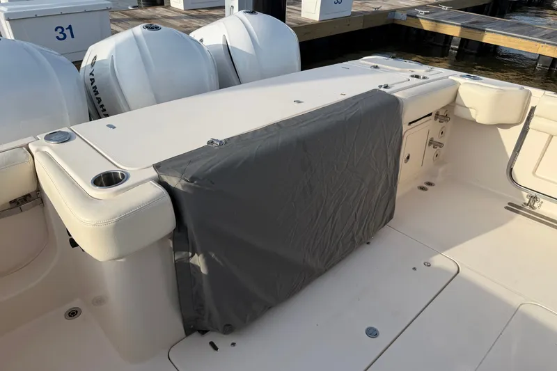 Slide: The Image of 2019 Grady-White Canyon 336 boat interior with Yamaha engines at dock. - 49