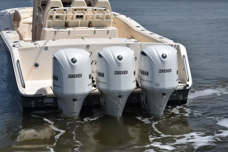 Slide: The Image of 2019 Grady-White Canyon 336 boat with triple Yamaha 300 engines on water. - 13