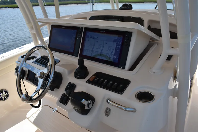 Slide: The Image of 2019 Grady-White Canyon 336 helm with dual displays and steering wheel. - 28