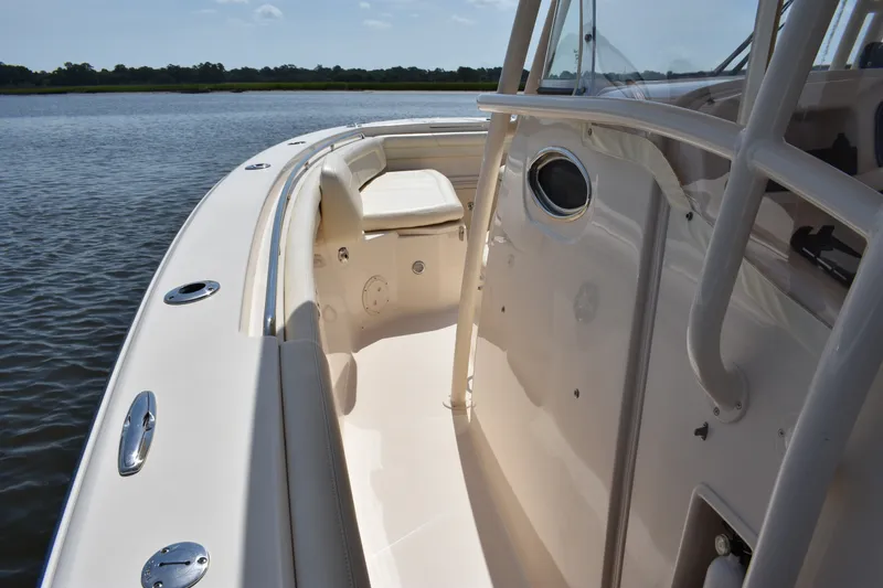Slide: The Image of 2019 Grady-White Canyon 336 boat interior with seating, on calm water. - 16