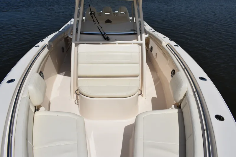 Slide: The Image of 2019 Grady-White Canyon 336 boat interior with white seating and open deck. - 18