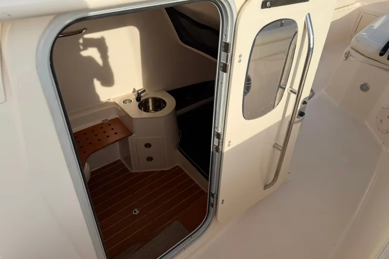 Slide: The Image of 2019 Grady-White Canyon 336 cabin interior with sink and seating area. - 37