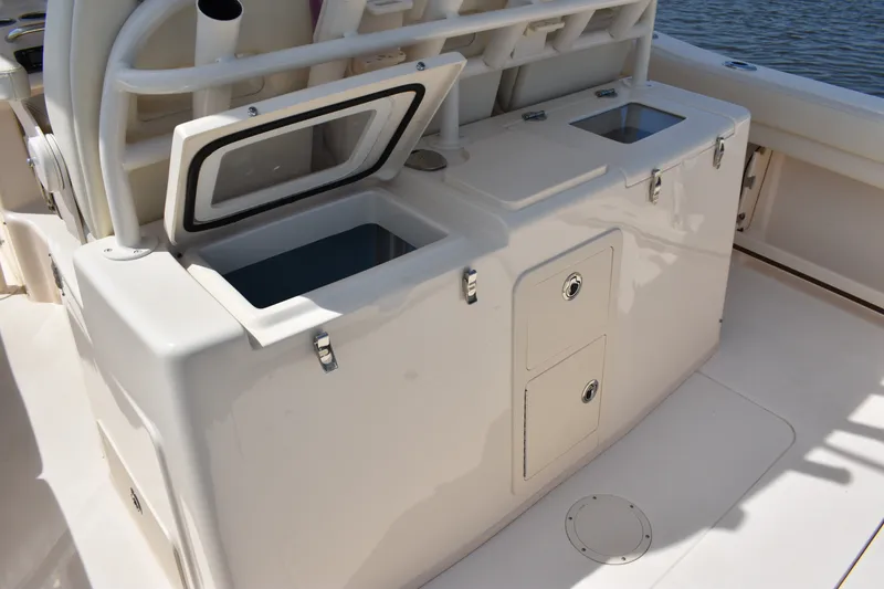 Slide: The Image of 2019 Grady-White Canyon 336 boat interior with storage compartments and open hatch. - 27