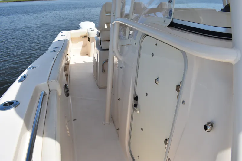 Slide: The Image of 2019 Grady-White Canyon 336 boat deck with sleek design and storage compartments. - 20