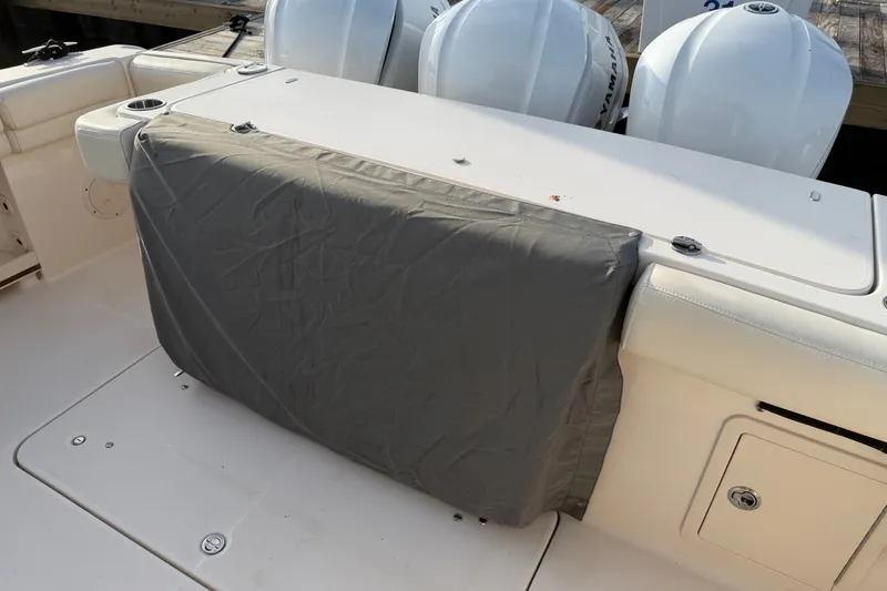 Slide: The Image of 2019 Grady-White Canyon 336 boat deck with covered seating and Yamaha engines. - 48