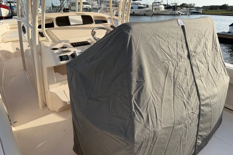 Slide: The Image of 2019 Grady-White Canyon 336 boat helm covered, docked at marina. - 51