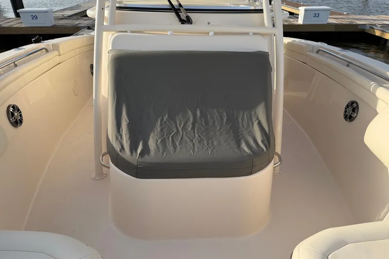 Slide: The Image of 2019 Grady-White Canyon 336 boat interior with cushioned seating and speakers. - 52