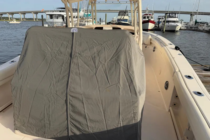 Slide: The Image of 2019 Grady-White Canyon 336 boat with covered console, docked at marina. - 50