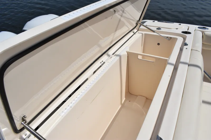 Slide: The Image of Open storage compartment on 2019 Grady-White Canyon 336 boat, showcasing spacious interior. - 24
