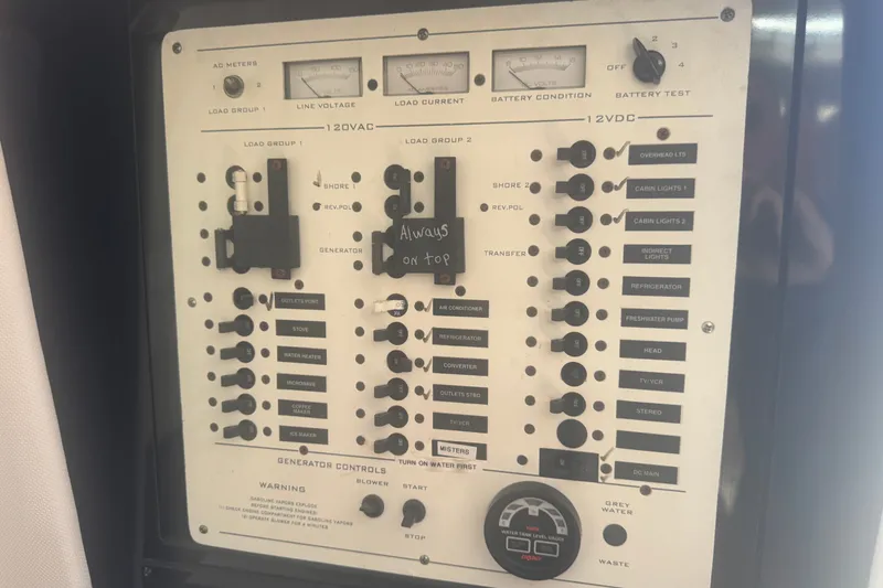 Slide: The Image of Control panel of a 2003 PROLINE 33 Express boat with various switches and meters. - 6