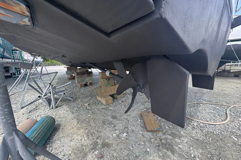 Slide: The Image of 2003 PROLINE 33 Express boat hull and propeller on dry dock. - 44