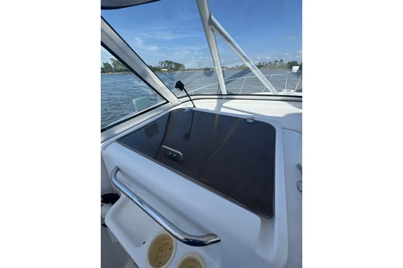 Slide: The Image of 2003 PROLINE 33 Express boat interior with water view and clear blue sky. - 27