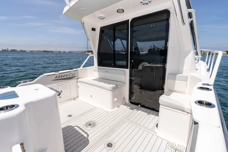 Slide: The Image of 2021 ArrowCat 320 boat deck with seating, ocean view, and sleek design. - 13