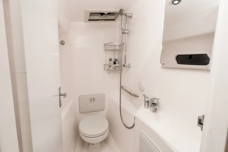 Slide: The Image of Compact bathroom in 2021 ArrowCat 320 boat with shower, toilet, and sink. - 26