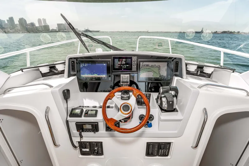 Slide: The Image of Cockpit of 2021 ArrowCat 320 boat with advanced navigation systems and controls. - 22