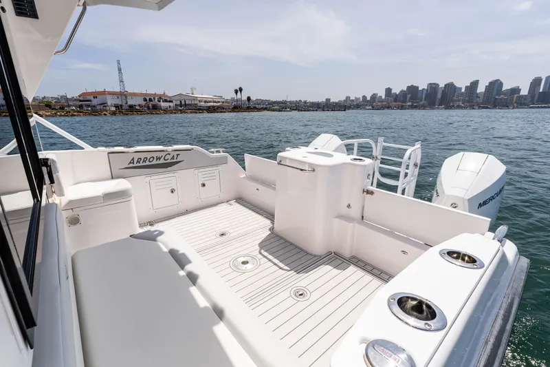 Slide: The Image of 2021 ArrowCat 320 boat deck with city skyline and waterfront view. - 12