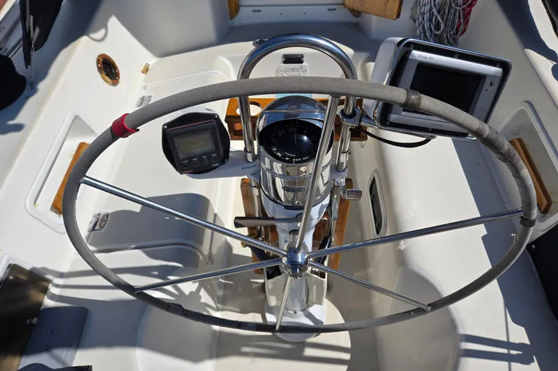 Slide: The Image of Steering wheel and navigation instruments on a 1990 Pearson 385 sailboat cockpit. - 4