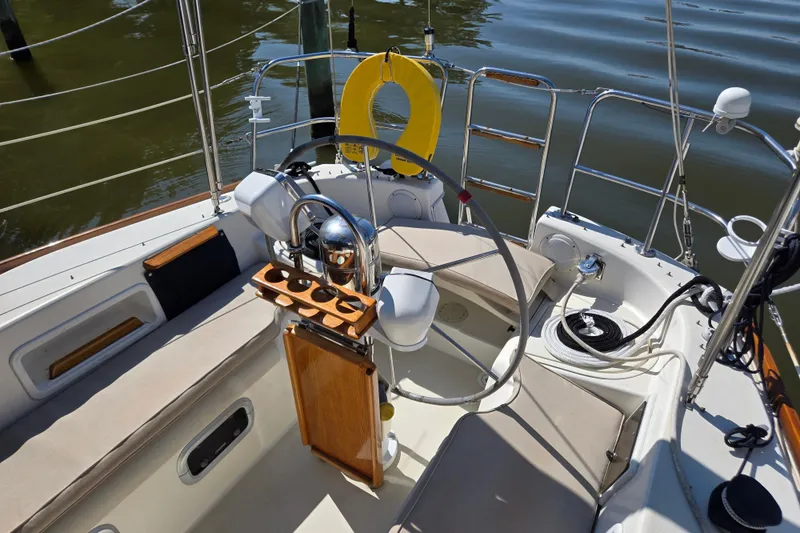 The Image of Cockpit of a 1990 Pearson 385 sailboat with steering wheel and seating. - 1