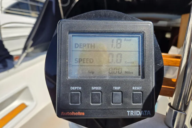 Slide: The Image of Autopilot display on 1990 Pearson 385 sailboat showing depth and speed readings. - 5