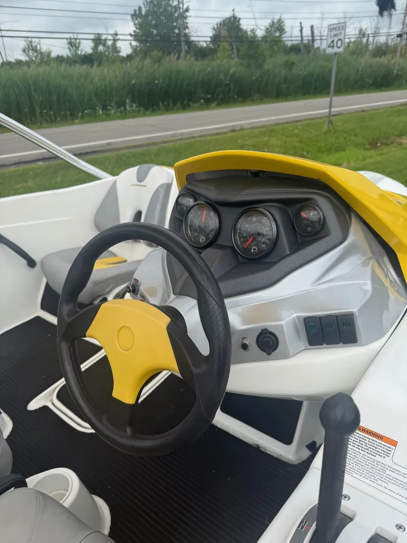 Slide: The Image of The image shows the cockpit of a 2006 Sea-Doo Sportster SCIC with yellow accents. - 6