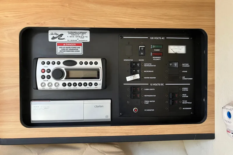 Slide: The Image of Control panel of a 2006 Sea Ray 290 Sun Sport boat with Clarion audio system. - 26