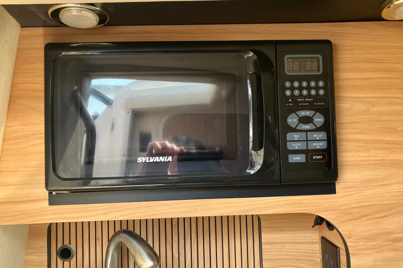 Slide: The Image of Sylvania microwave in 2006 Sea Ray 290 Sun Sport boat kitchen. - 22