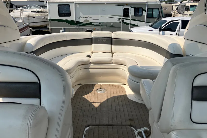 Slide: The Image of Interior of a 2006 Sea Ray 290 Sun Sport boat with plush seating. - 5