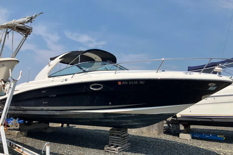 The Image of 2006 Sea Ray 290 Sun Sport boat on dry dock, side view. - 1