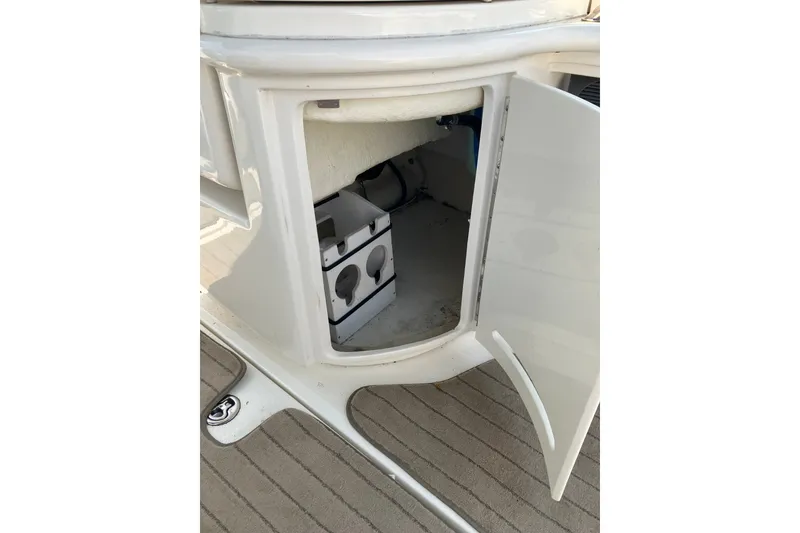 Slide: The Image of Open storage compartment on a 2006 Sea Ray 290 Sun Sport boat. - 16