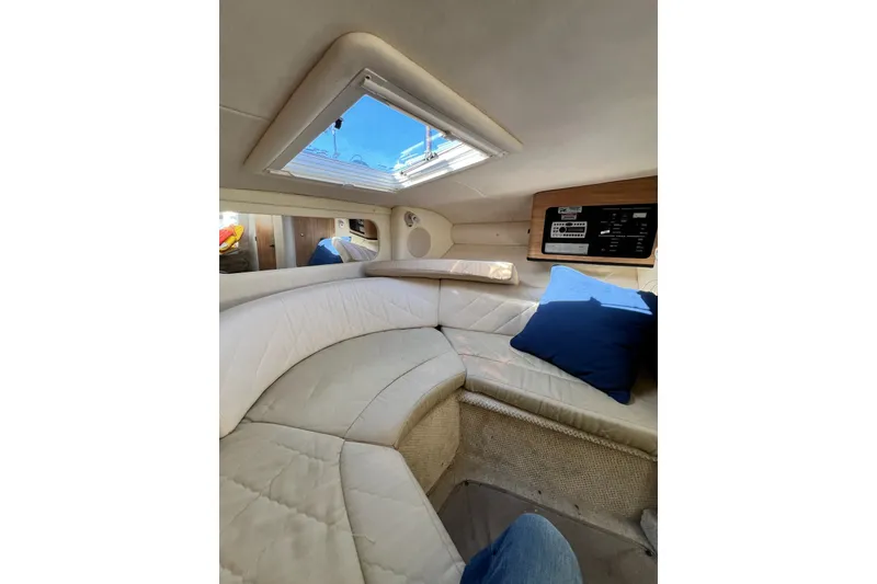 Slide: The Image of Interior of 2006 Sea Ray 290 Sun Sport boat with cozy seating and skylight. - 31