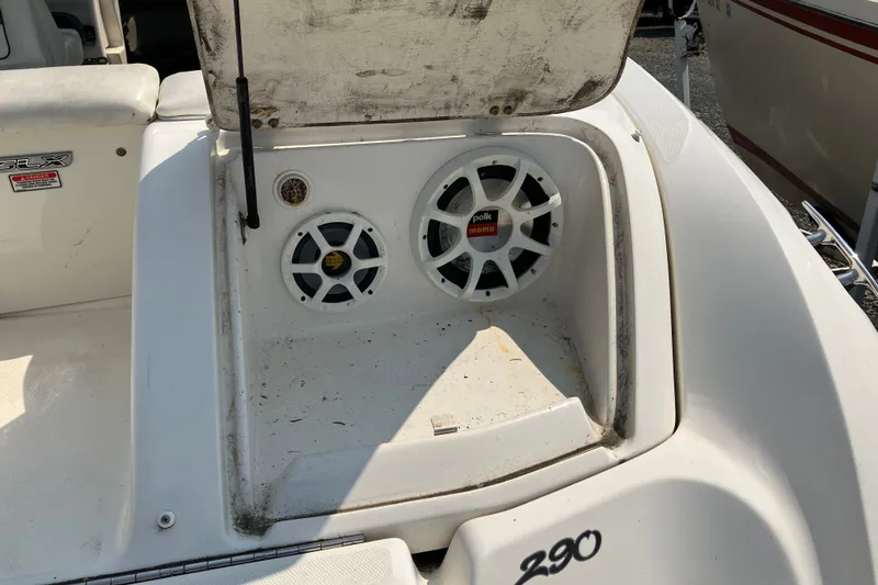 Slide: The Image of 2006 Sea Ray 290 Sun Sport boat with Polk audio speakers in storage compartment. - 13
