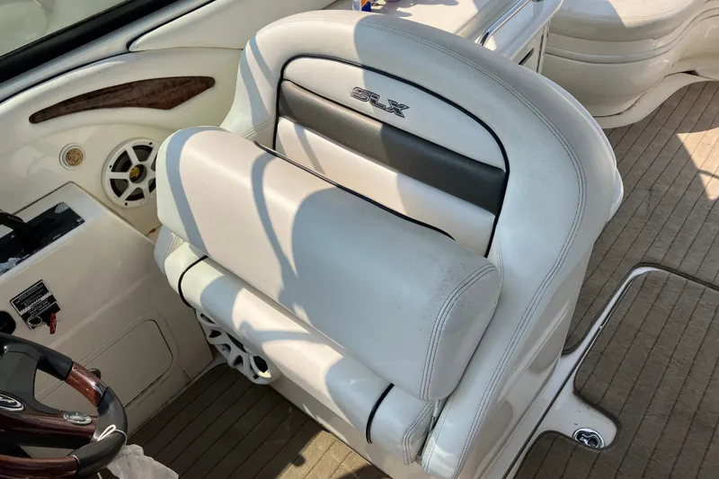 Slide: The Image of Luxury seating on a 2006 Sea Ray 290 Sun Sport boat, featuring white upholstery and sleek design. - 6