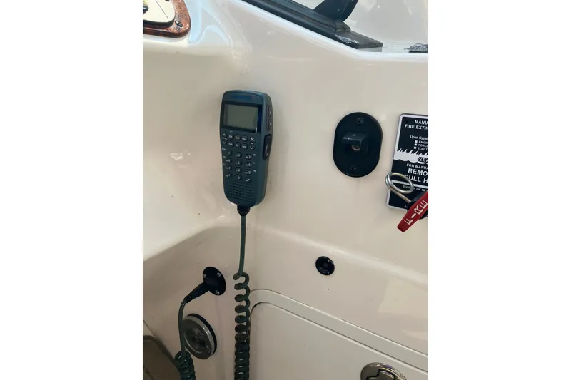 Slide: The Image of Control panel of a 2006 Sea Ray 290 Sun Sport boat with communication device. - 10