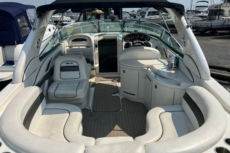 Slide: The Image of 2006 Sea Ray 290 Sun Sport boat interior with seating and dashboard view. - 4