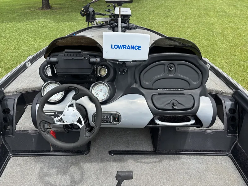 Slide: The Image of The image shows the cockpit of a 2011 Nitro Z9 CDC boat with a Lowrance fish finder. - 11