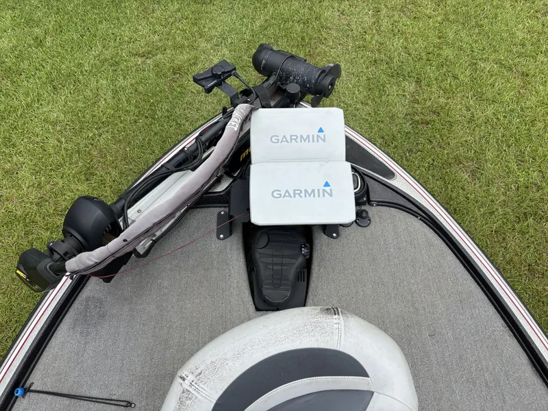Slide: The Image of A 2011 Nitro Z9 CDC boat with Garmin electronics on the deck, parked on grass. - 15
