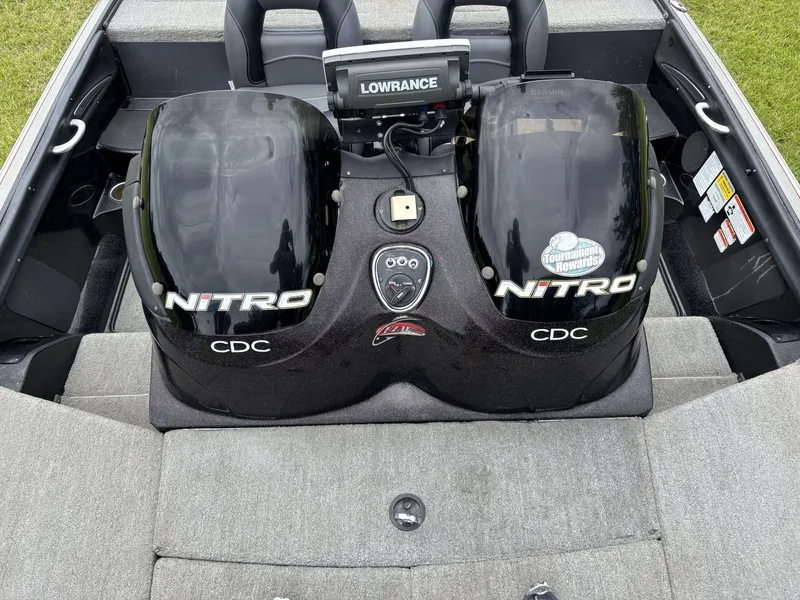 Slide: The Image of The image shows the cockpit of a 2011 Nitro Z9 CDC boat with two engine covers and a Lowrance device. - 18