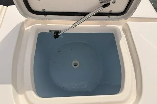 Slide: The Image of Livewell compartment on a 2015 Grady-White Freedom 285 boat, open lid view. - 16