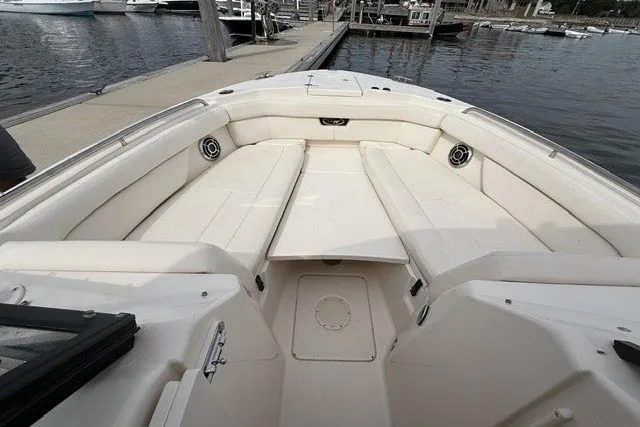 Slide: The Image of 2015 Grady-White Freedom 285 boat interior with spacious seating at dock. - 8