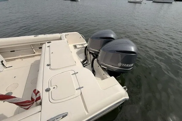 Slide: The Image of 2015 Grady-White Freedom 285 boat with twin Yamaha outboard engines on water. - 4