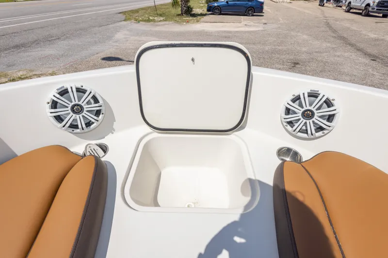 Slide: The Image of 2021 Stingray 182 SC boat interior with speakers and storage compartment. - 35