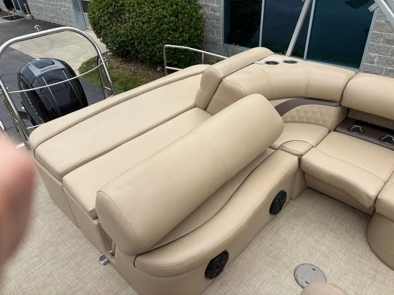 Slide: The Image of The image shows the beige seating layout of a 2019 Harris Sunliner 230. - 10